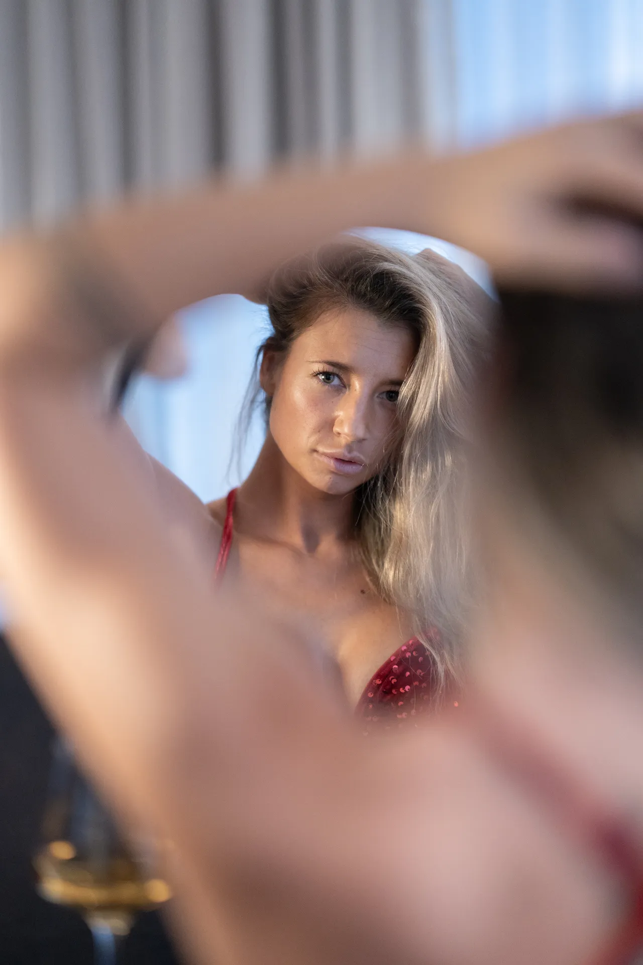 April Carter posing in front of a mirror